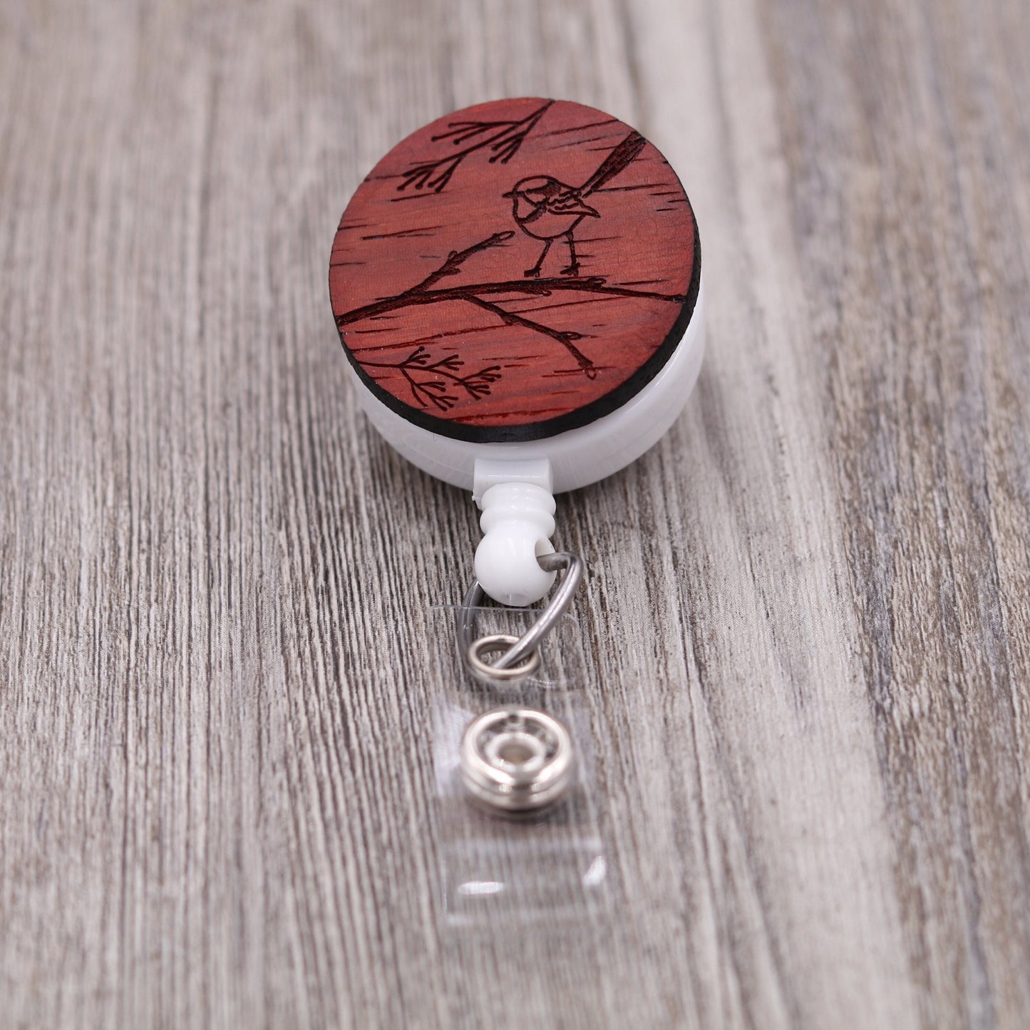 Single Bird on Branch Badge Reel